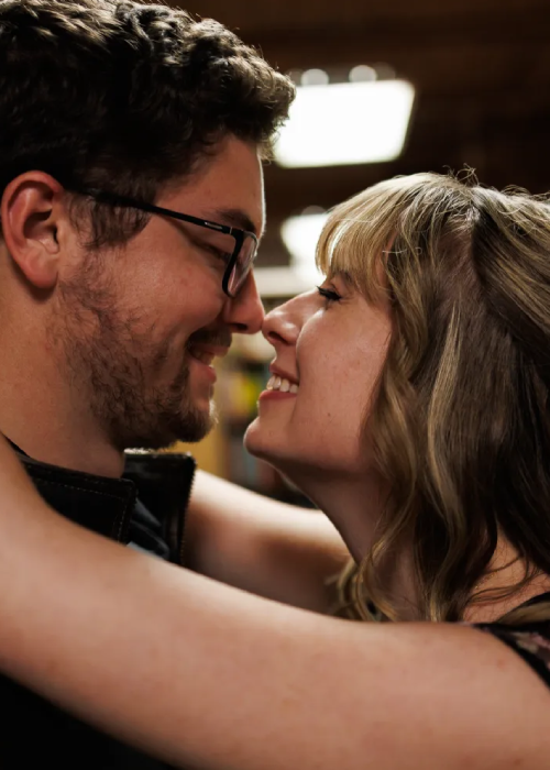A close-up of two people in an intimate embrace, showcasing their arms and shoulders, with a soft focus background. A close-up of two people in an intimate embrace, showcasing their arms and shoulders, with a soft focus background.